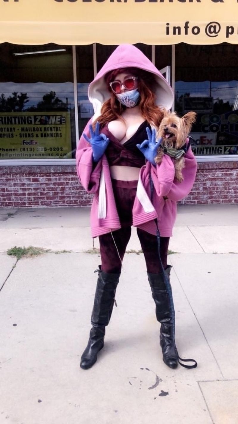 Phoebe Price in a Purple Ensemble With a Surgical Mask and Gloves 03/24/2020