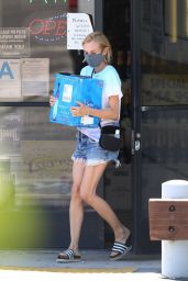 Diane Kruger Wearing a Tie-Dye Shirt Over Frayed Denim Shorts