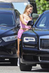 Hailey Bieber in a Pink Crop Top With Tiny Shorts