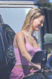 Hailey Bieber in a Pink Crop Top With Tiny Shorts