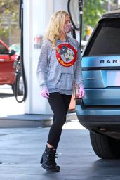 Holly Madison Wearing a Relaxed Grey Mickey Mouse Hoodie and Black Leggings