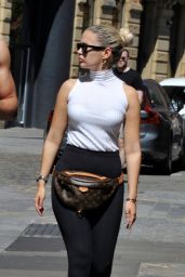 Molly Mae Hague in a White Sleeveless Turtleneck Top With Black Leggings