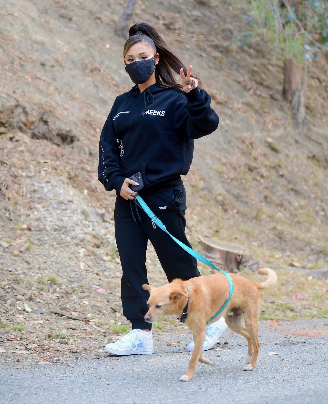 Ariana Grande in All-Black Sweats and White and Blue Nike ...