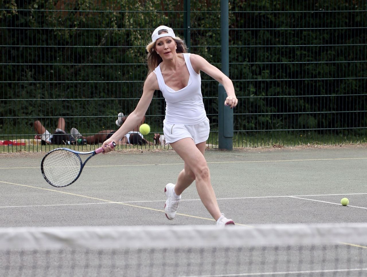 Caprice Bourret in All White Ensemble - Enjoy a Game of Tennis in