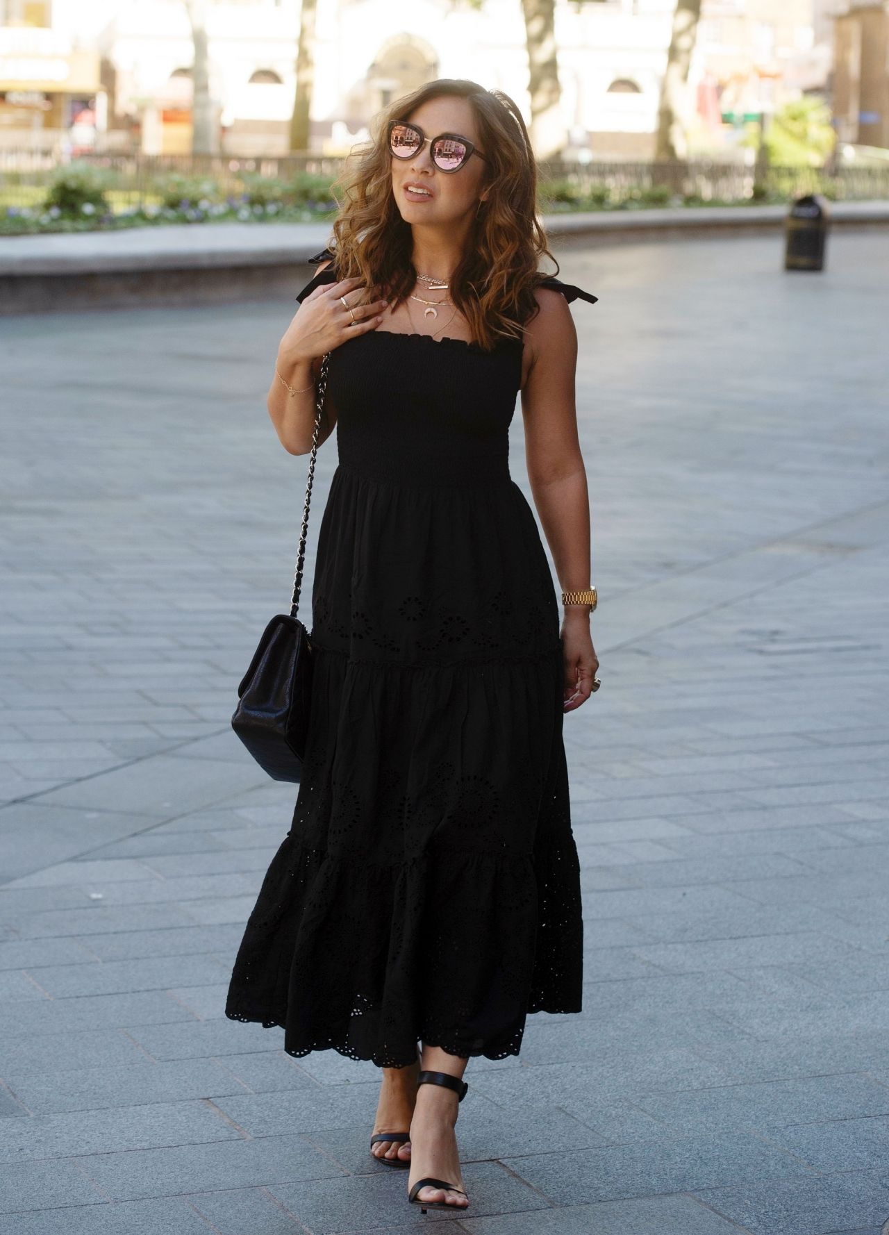 Myleene Klass in a Black Broderie Anglaise Dress and Classic Chanel Bag