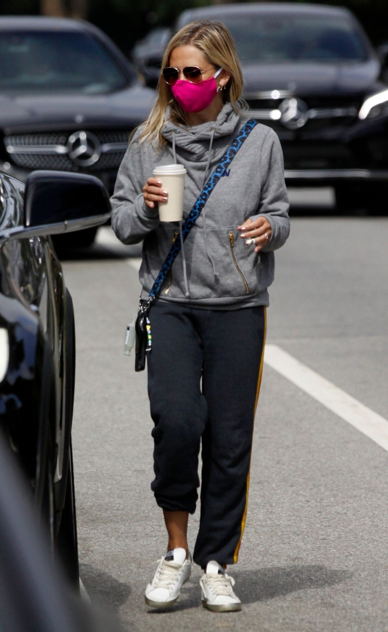 Kate Hudson sports an Aviator Nation hoodie and grey leggings while heading  for a workout in