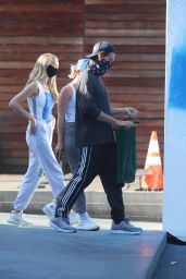 Abby Champion in a Light Grey Joggers, White Yeezy Sneakers and a Blue and White Nike Tank With Patrick Schwarzenegger 08/04/2020