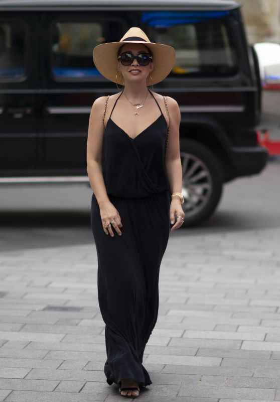 Myleene Klass in a Plunging Black Maxi Dress and a Large Sun Hat - London 09/04/2020
