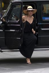 Myleene Klass in a Plunging Black Maxi Dress and a Large Sun Hat - London 09/04/2020