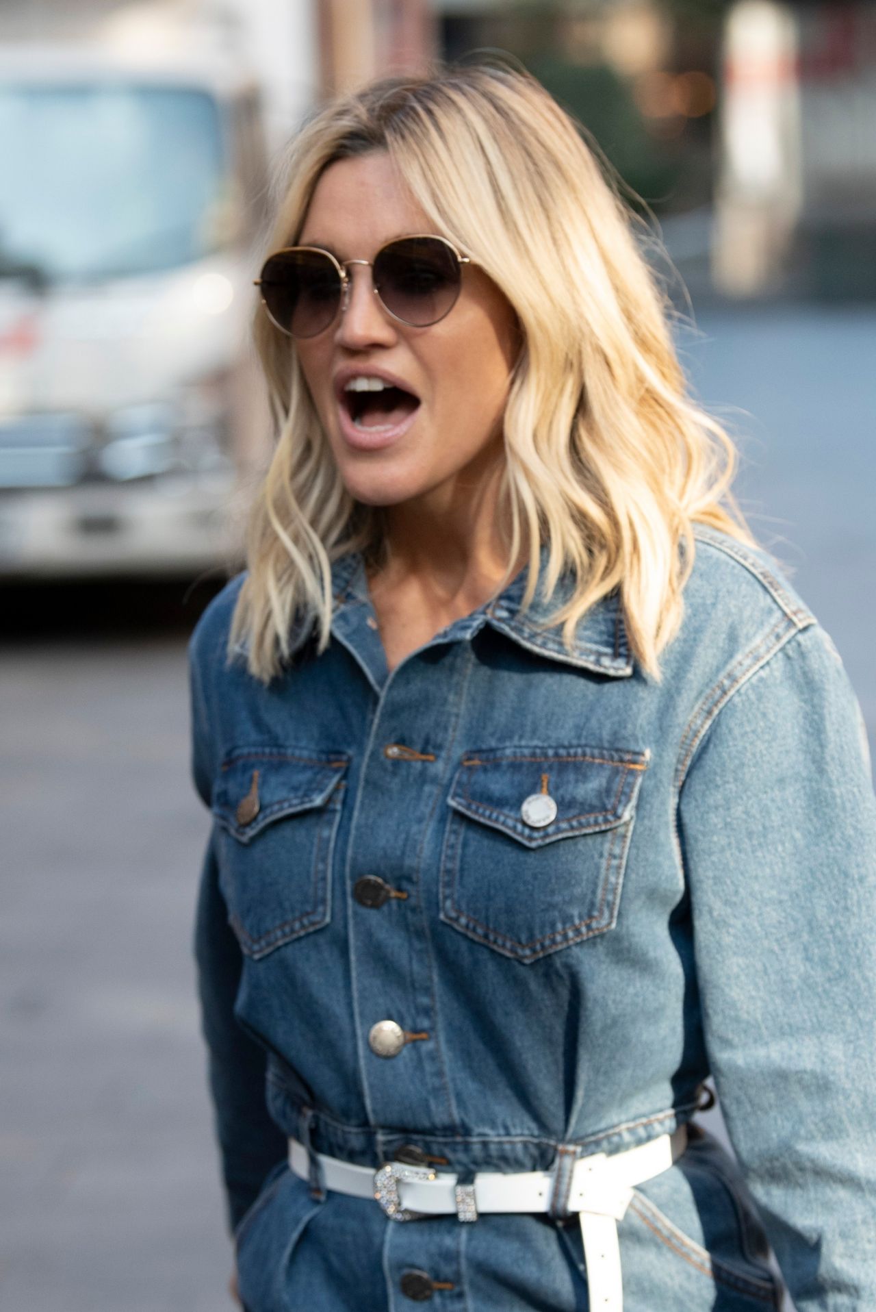 Ashley Roberts in a Denim Mini Dress and Striking White Boots - London