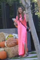 Chrissy Teigen in a Pink Satin Dress - Pumpkin Farm 10/25/2020