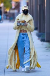 Hailey Bieber in a Thick, Fuzzy Yellow Coat and Pair of Baggy Acid Wash Jeans - NYC 10/17/2020