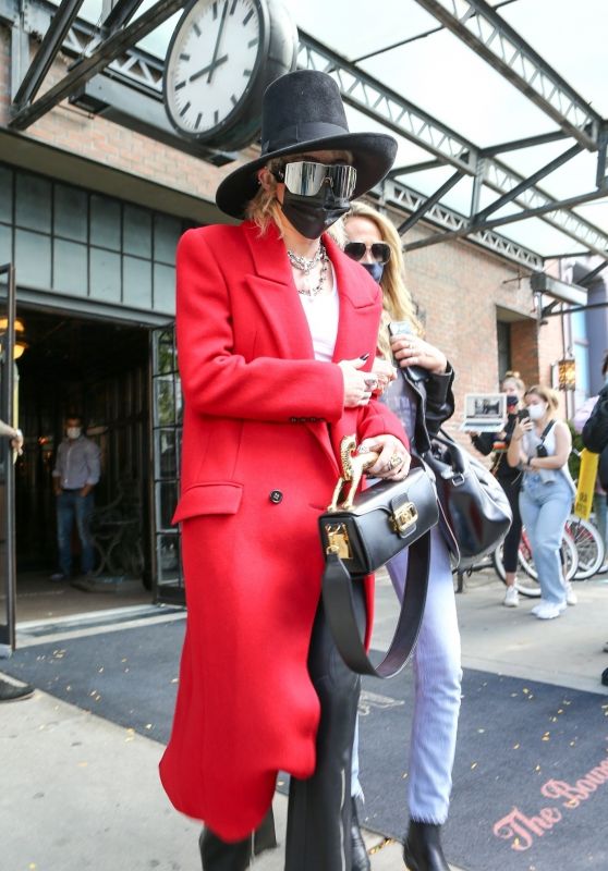 Miley Cyrus in a Red Trench Coat, Black Leather Pants and a Black Hat - NYC 10/02/2020