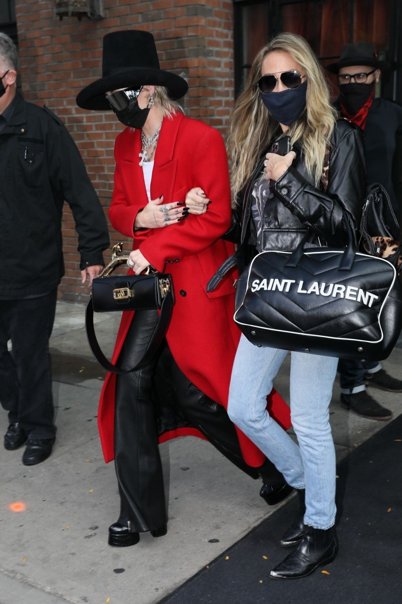 https://celebmafia.com/wp-content/uploads/2020/10/miley-cyrus-in-a-red-trench-coat-black-leather-pants-and-a-black-hat-nyc-10-02-2020-9.jpg