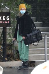 Lili Reinhart in a Matching Green Sweatsuit and a Pair of Black Fleece-Lined Snow Boots - Vancouver 12/09/2020