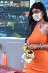 Kylie Jenner in an Orange Dress - Pumps Gas in Bel Air 02/22/2021
