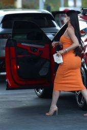 Kylie Jenner in an Orange Dress - Pumps Gas in Bel Air 02/22/2021