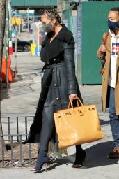 Chrissy Teigen in a Full-Length Black Leather Coat and Open-Toe High Heels - NY 03/07/2021