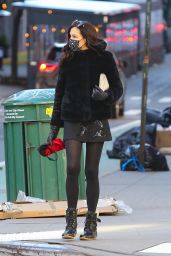 Famke Janssen Looks Stylish in a Black Faux Fur Puffer Jacket and a Mini-Skirt and Snow Boots 03/02/2021