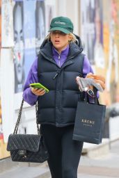 Paige Lorenze Wearing a MadHappy Green Hat and a CHANEL Bag - New York 03/16/2021