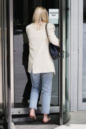 Mollie King in Striped Top Denim Trousers and Cream Blazer 04/24/2021