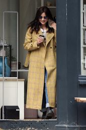 Jenna Coleman Wearing Blue Tinted Shades, Mustard Checkered Coat, Cream Top, Jeans and a Pair of Boots 05/17/2021