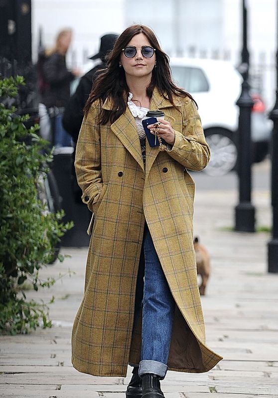 Jenna Coleman Wearing Blue Tinted Shades, Mustard Checkered Coat, Cream Top, Jeans and a Pair of Boots 05/17/2021