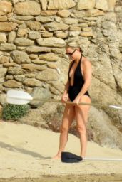 Kate Hudson in a Plunging Black Swimsuit on the Beach in Greece 06/13/2021