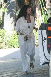 Lori Harvey in a White Jumpsuit at the Sunset Towers in West Hollywood 06/23/2021