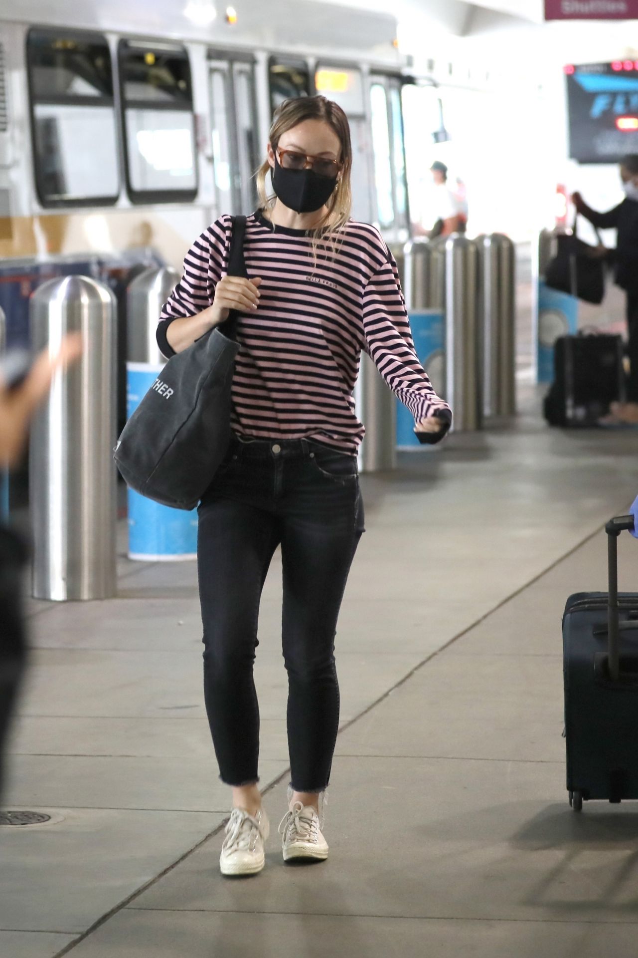 Olivia Wilde in Tight Jeans and Striped Shirt - Airport in LA 06/20 ...