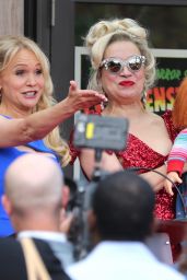 Jennifer Tilly Holding Up the Chucky Doll - "Chucky" TV Series Set in Toronto 08/09/2021