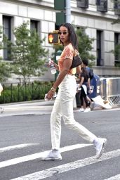 Laura Harrier in a Tie-die Shirt and Off-white Pants and White Sneakers - New York 09/12/2021