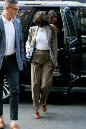 Dakota Johnson Wears a Plaid Blazer and Striped Pants - New York 09/30/2021