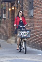 Famke Janssen - Cycling Wearing a Red Bomber Jacket and Black Tutu Skirt - New York 10/20/2021