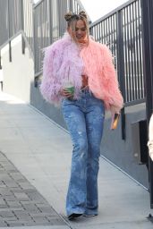 Chrissy Teigen Wears a Pink Feathered Sweater and Blue Jeans - Los Angeles 11/09/2021