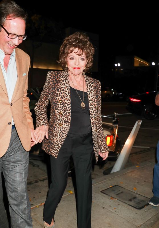 Joan Collins Wears a Leopard Print Blazer at Craig