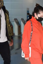 Selena Gomez in All Orange at JFK Airport in New York 11/22/2021
