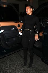 Karrueche Tran Wears a One-piece Black Bodysuit and Knee-high Boots - West Hollywood 01/15/2022