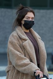 Anastasia Karanikolaou in an Oversized Coat and Snow Boots - Arrives in Milan 02/23/2022