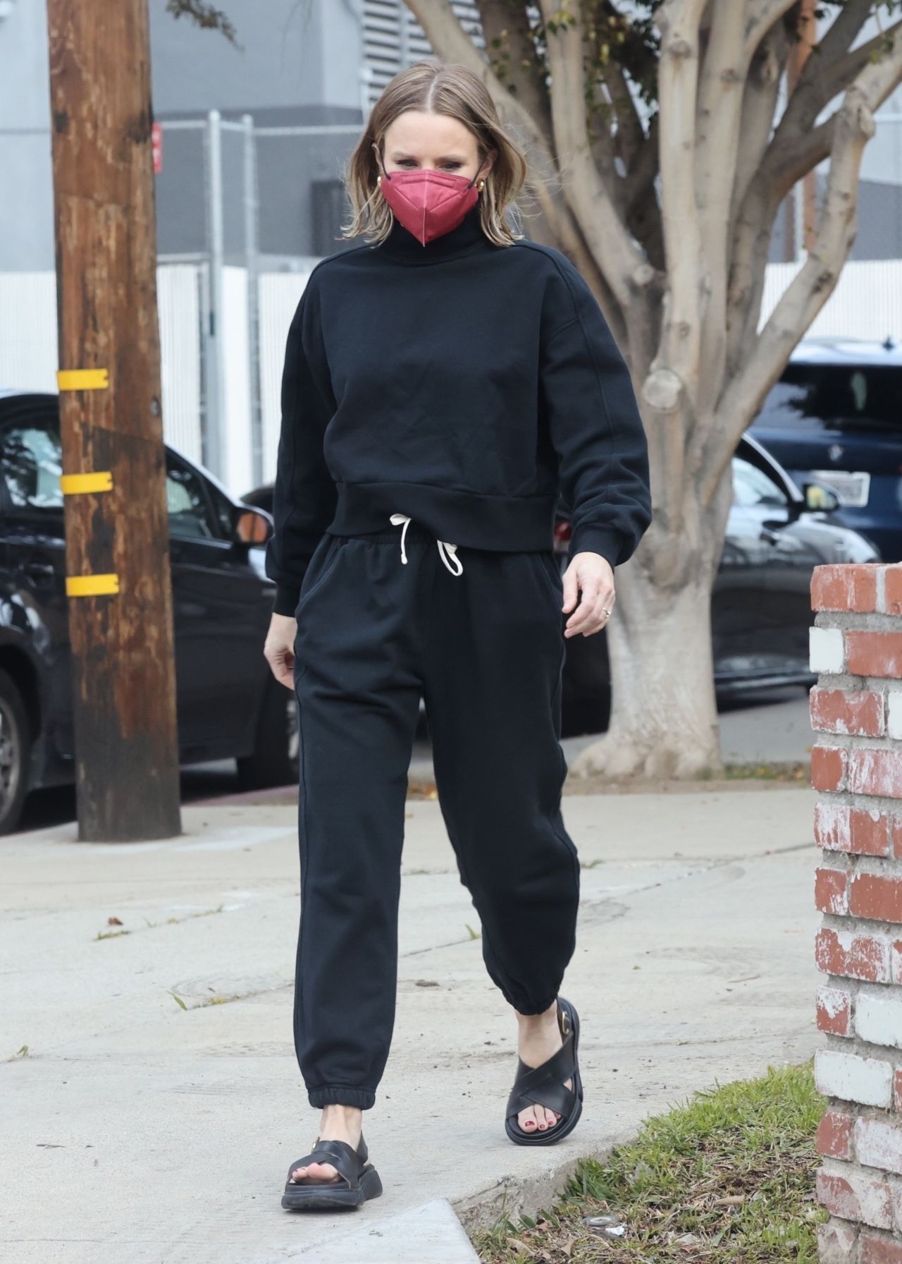 Kristen Bell wears a 'Mickey Mouse' sweatshirt and leggings as she