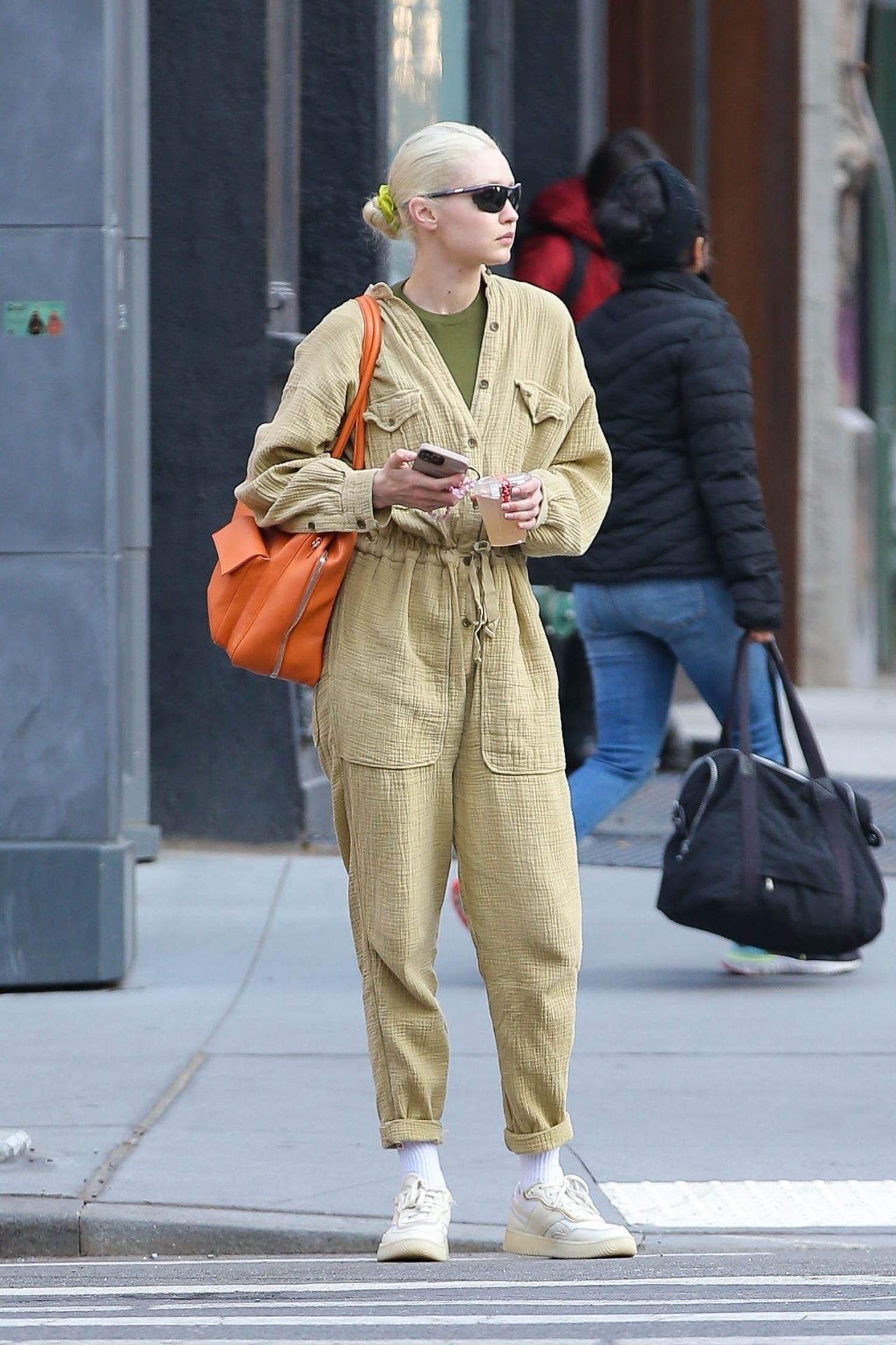 gigi hadid sports white jumpsuit and prada backpack as she arrives at  florence airport, italy-120619_10