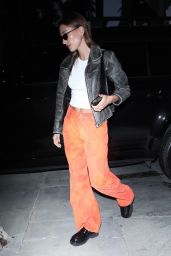 Hailey Rhode Bieber in Orange Pants, White Top and Leather Jacket - Los Angeles 03/23/2022