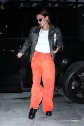 Hailey Rhode Bieber in Orange Pants, White Top and Leather Jacket - Los Angeles 03/23/2022