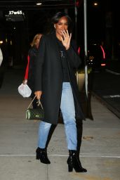 Kelly Rowland in Long Black Coat, Leather Boots and Denim - New York 03/15/2022