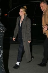 Kristen Stewart Wears a Black Pinstripe Suit and Overcoat - New York 03/10/2022