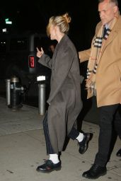 Kristen Stewart Wears a Black Pinstripe Suit and Overcoat - New York 03/10/2022