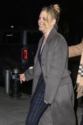 Kristen Stewart Wears a Black Pinstripe Suit and Overcoat - New York 03/10/2022