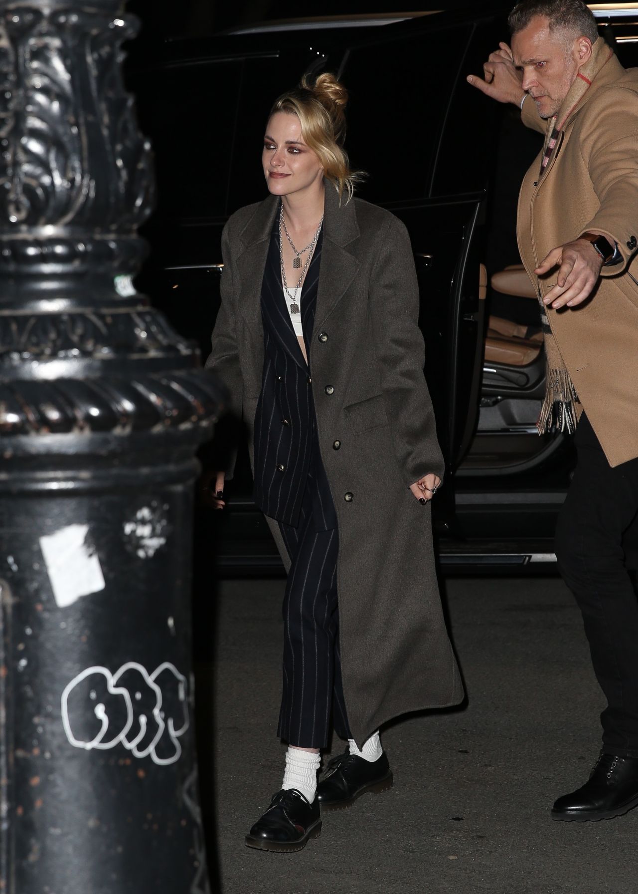 Kristen Stewart Wears A Black Pinstripe Suit And Overcoat - New York 03 