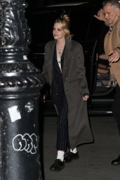 Kristen Stewart Wears a Black Pinstripe Suit and Overcoat - New York 03/10/2022