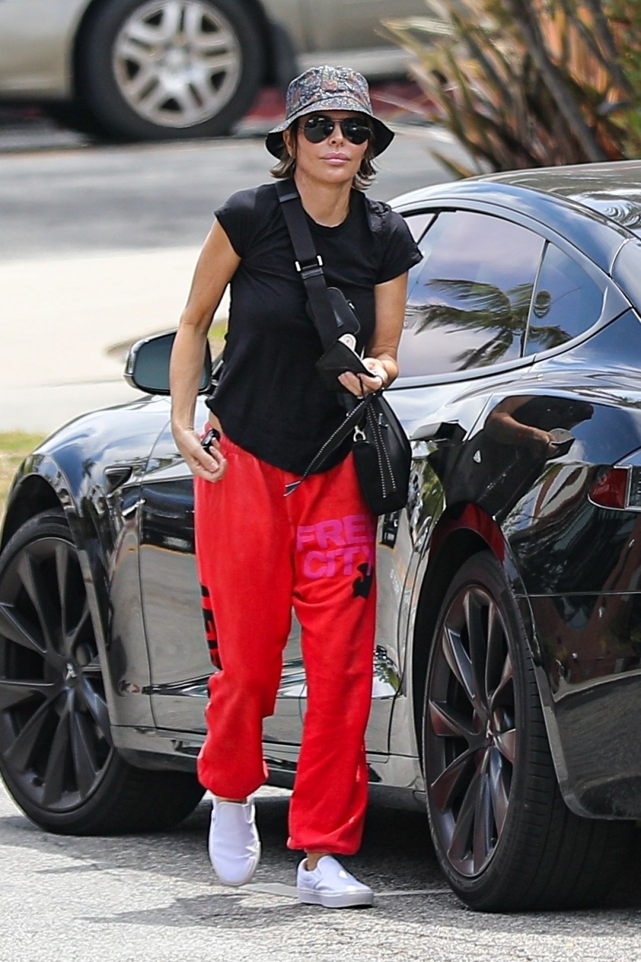 Lisa Rinna in a Red Free City Sweat Pants and Bucket Hat - Cafe Vida in